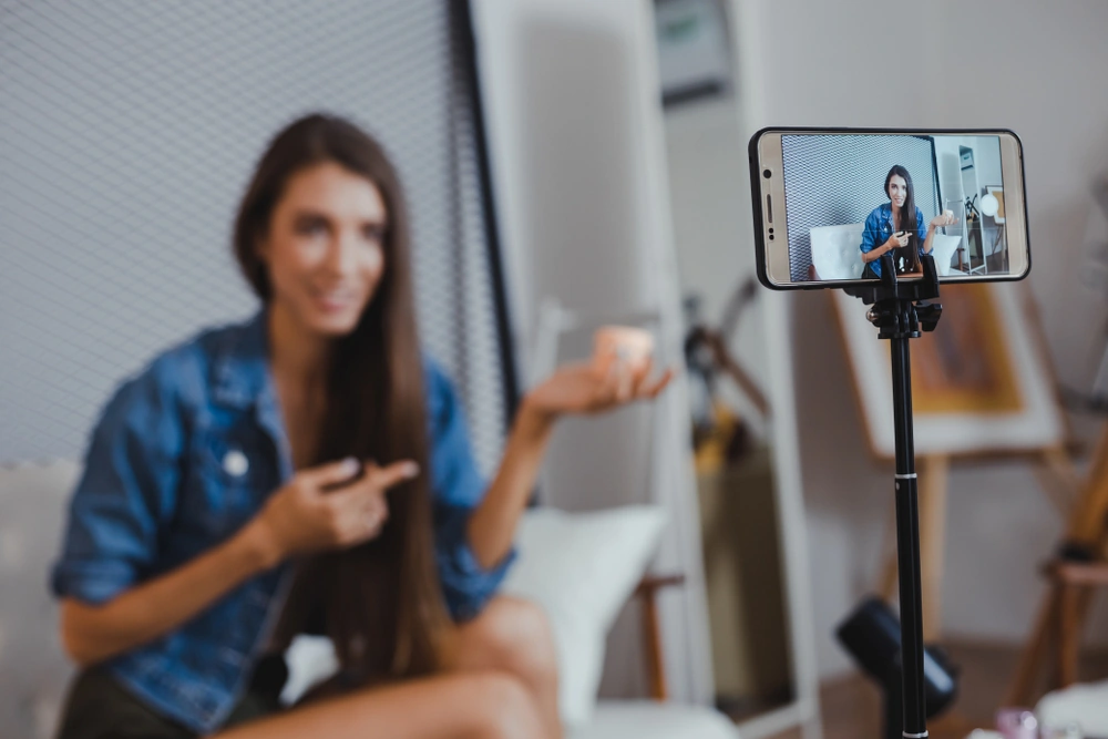  A woman recording herself recommending a product