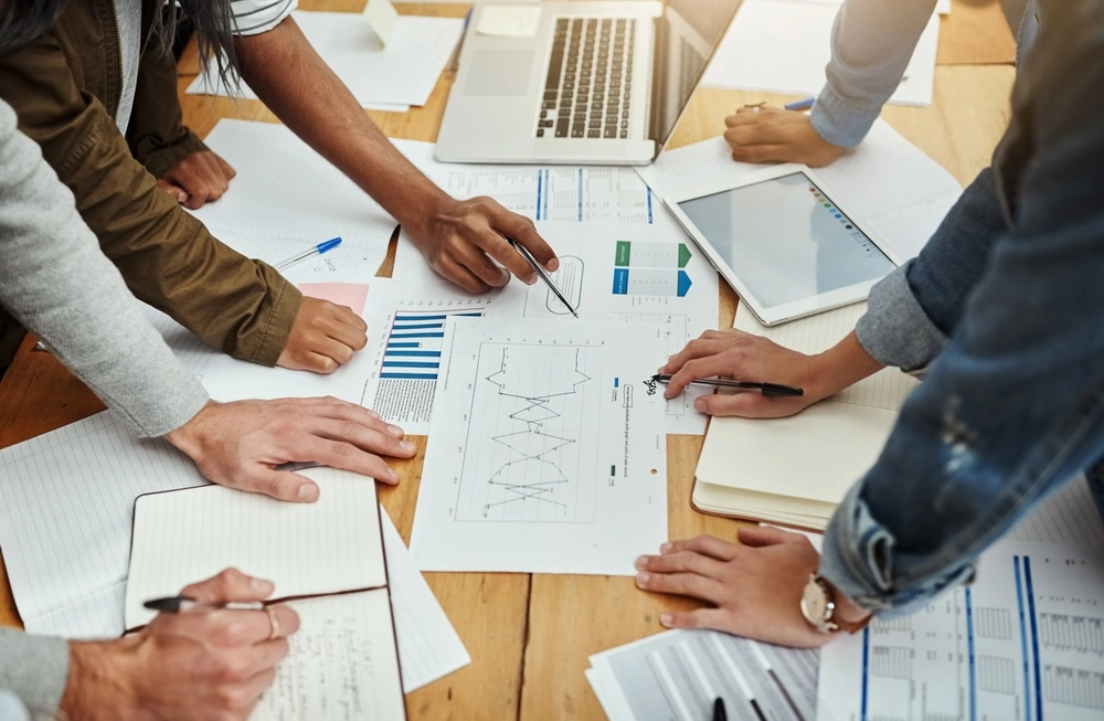 Office and content team collaboration with SEO and audience insights for website